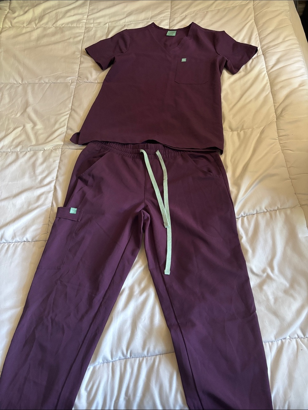 Womenโs Two-Piece Scrubs Set in Deep Plum